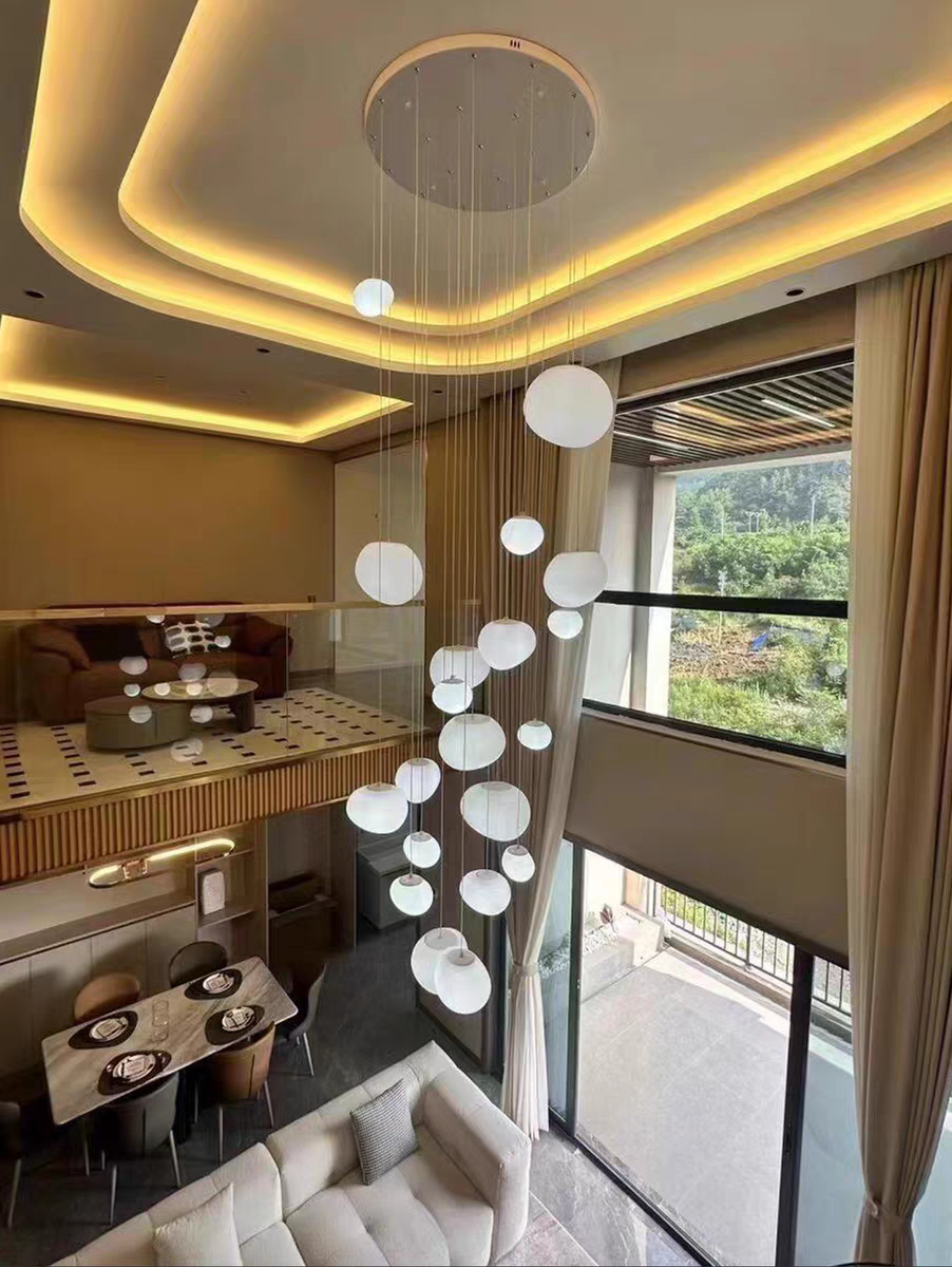 Handblown Pebble Glass Pendant: The Art of Organic Light & Stainless Steel